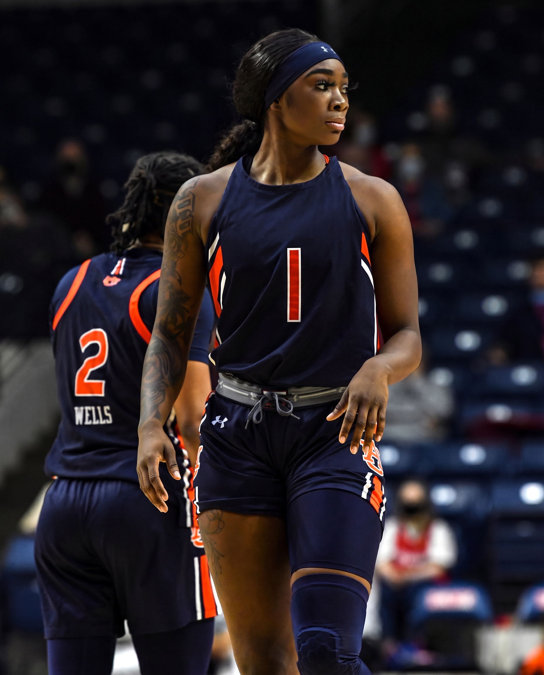 Basketball athlete standing on a gym court
